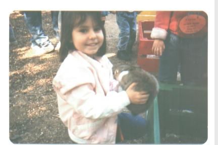 I'm holding a cute little bunny!